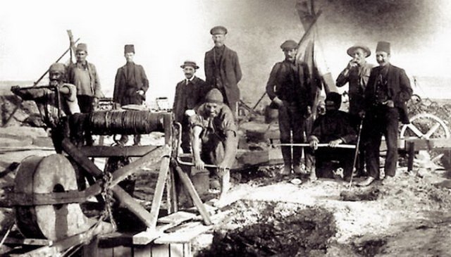 Circa 1895:  Azerbaijani oil workers digging an oil well by hand in the Bibi-Heybat suburb of Baku